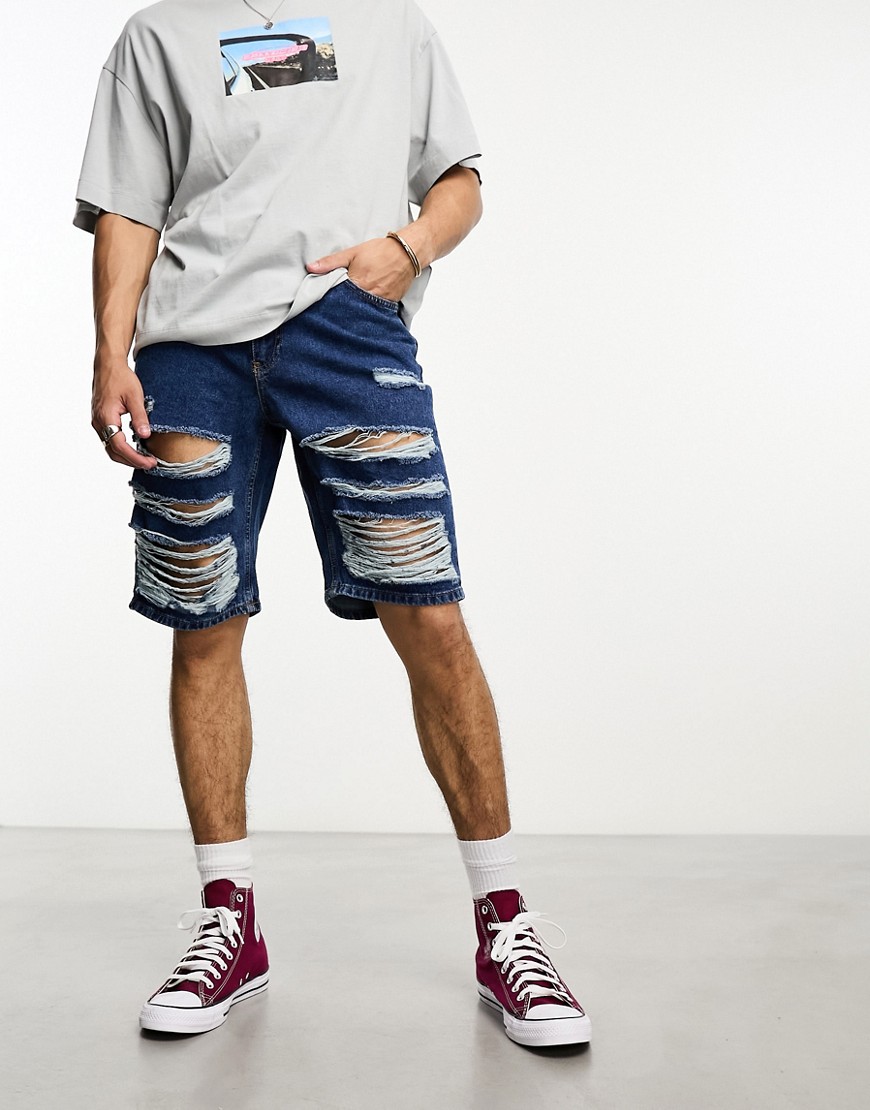 The Ragged Priest relaxed skate shorts with distressing in blue denim