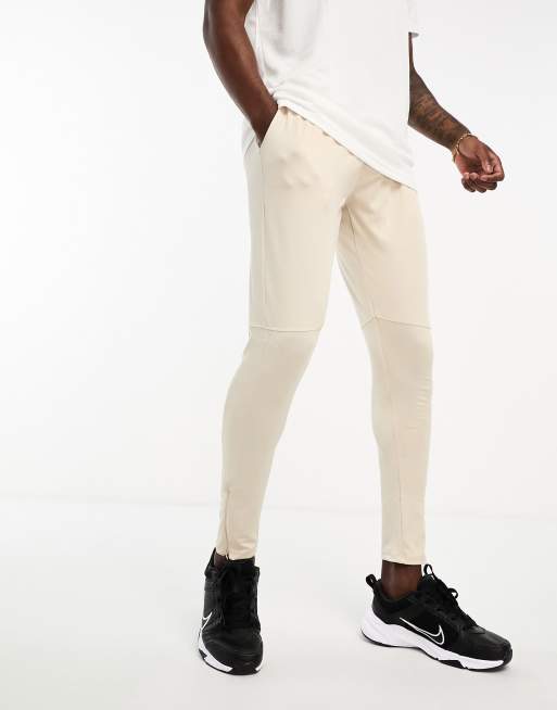 Threadbare Fitness skinny fit running trackies in stone