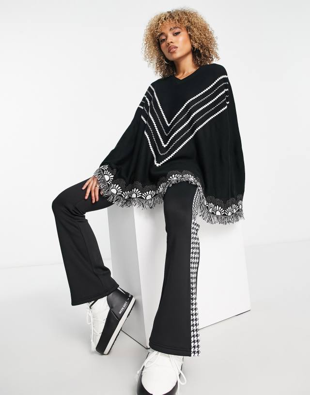 Threadbare Ski poncho with print trim in black