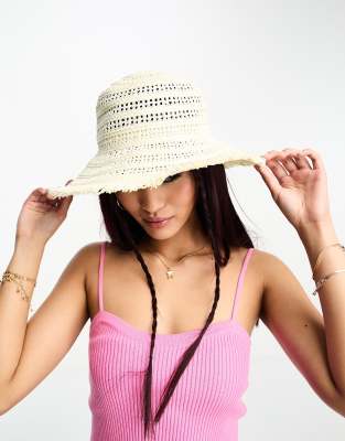 Threadbare straw hat with frayed edge detail in natural