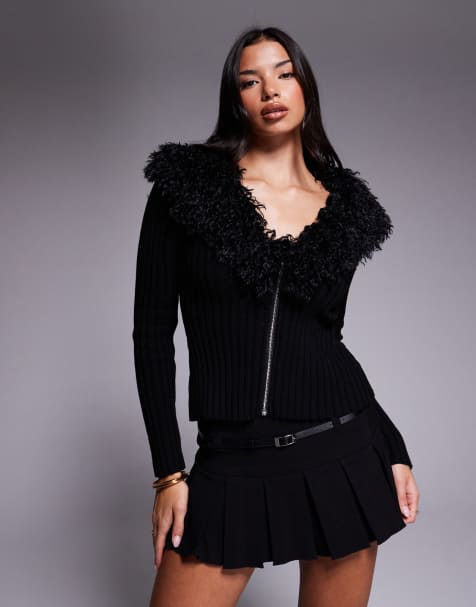 Tiger Mist – Brisa – Gerippte Strickjacke aus reiner Baumwolle in Schwarz mit Kunstpelzbesatz - view 1