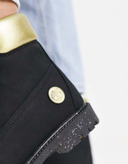 Champion black cheap and gold timberlands