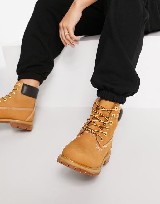 Timberland 6 inch premium lace up flat boots in wheat tan ASOS