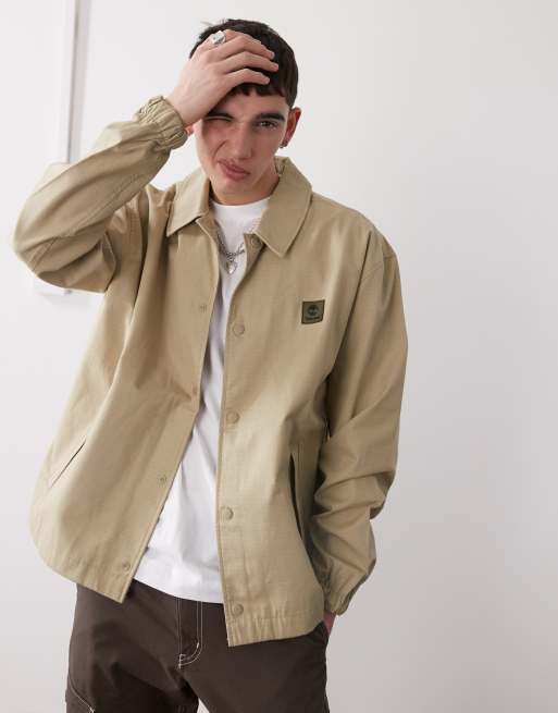 Timberland - Beige coach-jakke i ripstop-stof med logo på brystet