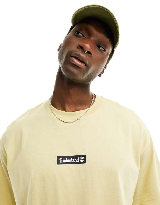 Timberland – Beżowy T-shirt oversize z logo pośrodku – Tylko w ASOS