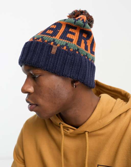 Timberland – Knit In – Strickmütze in Orange mit Umschlag