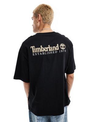 Timberland large script logo back print oversized t-shirt in black Exclusive to Asos