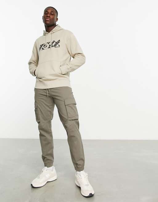 Timberland – Linear – Kapuzenpullover in Beige mit Logoprint
