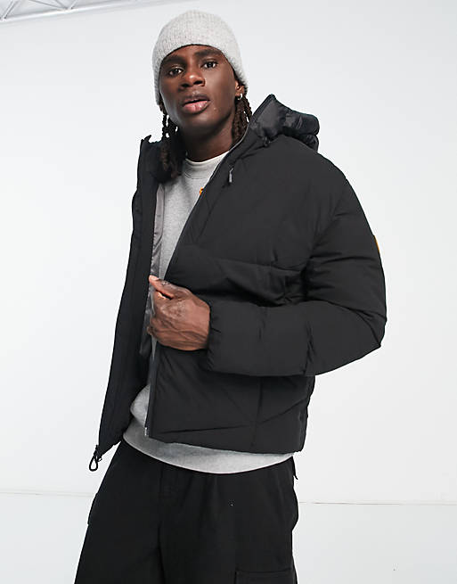 Timberland Neo Summit warmest quilted hooded jacket in black | ASOS