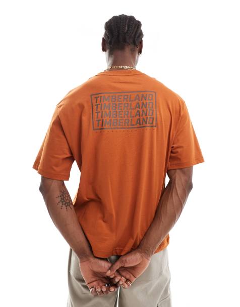 Timberland - Oversized T-shirt met herhaald logo in bruin, exclusief bij ASOS - view 1