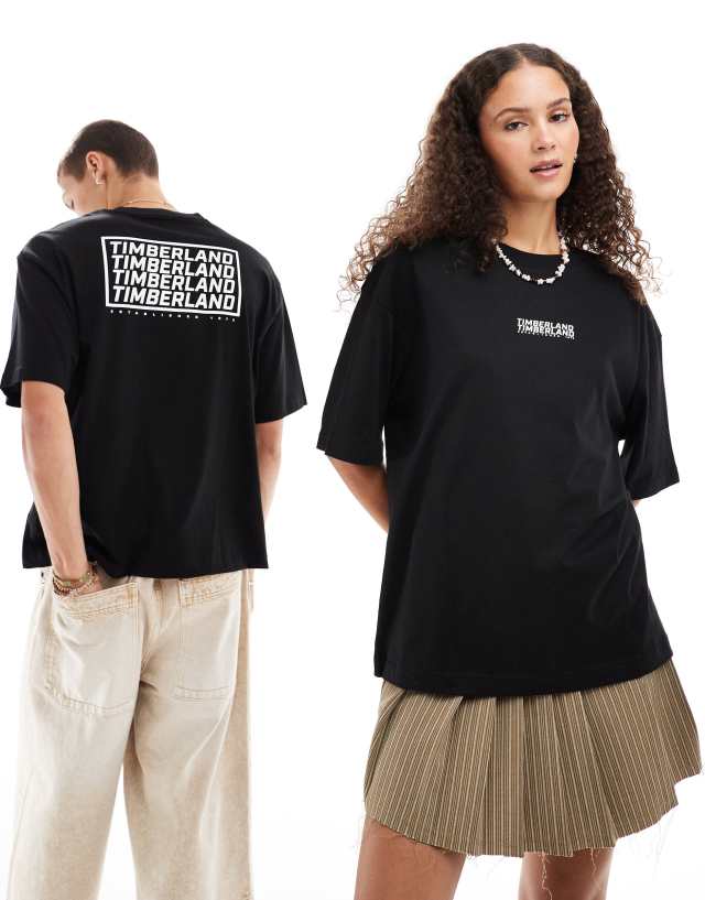 Timberland - oversized  t-shirt with repeat logo in black - exclusive to asos