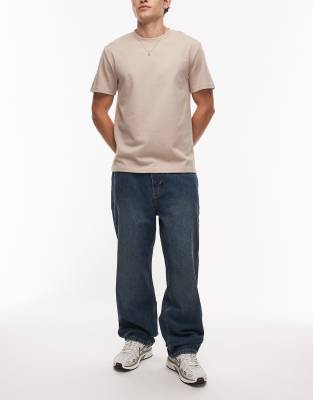 Timberland Timberland pocket logo baggy jeans in mid wash blue