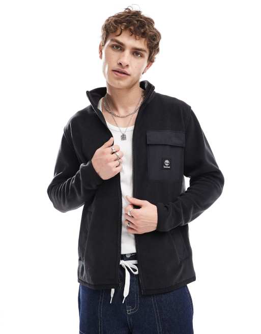 Timberland - Sort jakke med kontrastlomme og lynlås i fleece