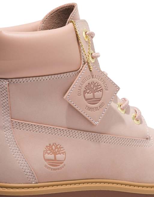 Baby pink shop timberlands with bow