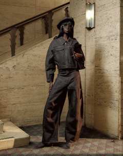 Model wearing Tolu Coker x Topshop barrel denim jacket circular design in brown rinse