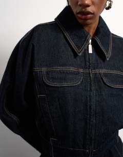 Model wearing Tolu Coker x Topshop barrel denim jacket circular design in indigo blue