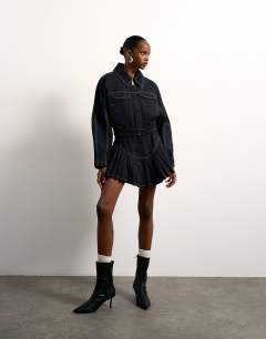 Model wearing Tolu Coker x Topshop barrel denim jacket circular design in indigo blue