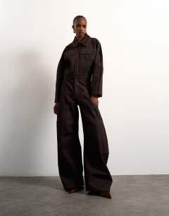 Model wearing Tolu Coker x Topshop barrel high rise jean circular design in brown rinse