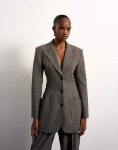 Model wearing Tolu Coker x Topshop cinched 80s blazer in taupe