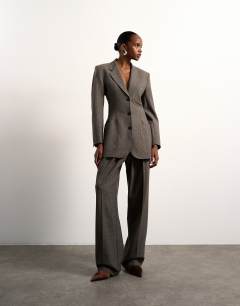 Model wearing Tolu Coker x Topshop cinched 80s blazer in taupe