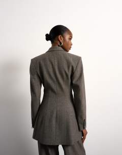 Model wearing Tolu Coker x Topshop cinched 80s blazer in taupe