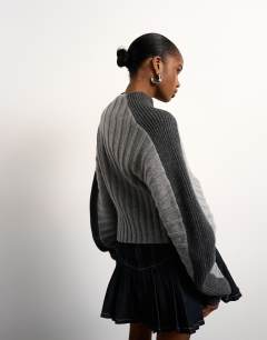 Model wearing Tolu Coker x Topshop knitted premium 100% lambswool ovoid sleeve jumper in grey