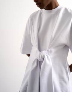 Model wearing Tolu Coker x Topshop seam tie detail tee design in ecru