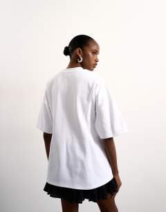 Model wearing Tolu Coker x Topshop seam tie detail tee design in ecru