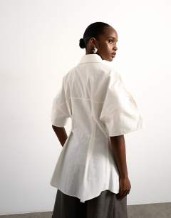 Model wearing Tolu Coker x Topshop short sleeve shirt in ecru