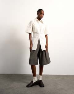 Model wearing Tolu Coker x Topshop short sleeve shirt in ecru