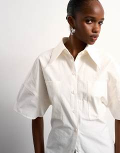 Model wearing Tolu Coker x Topshop short sleeve shirt in ecru