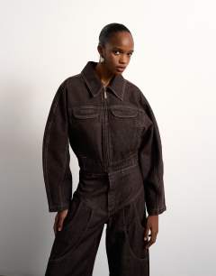 Model wearing Tolu Coker x Topshop&nbsp;barrel denim jacket circular design in brown rinse