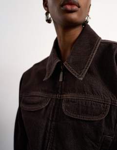 Model wearing Tolu Coker x Topshop&nbsp;barrel denim jacket circular design in brown rinse