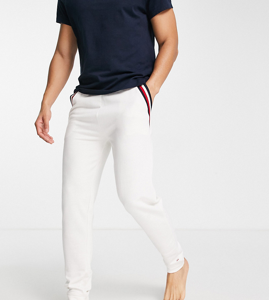 Tommy exclusive to ASOS lounge jogger with flag logo pocket stripes in cream-White