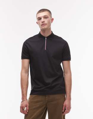 Tommy Hilfiger 1/4 zip polo shirt in black - view 1