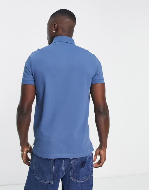 Tommy Hilfiger 1985 flag logo slim fit polo shirt in blue | ASOS