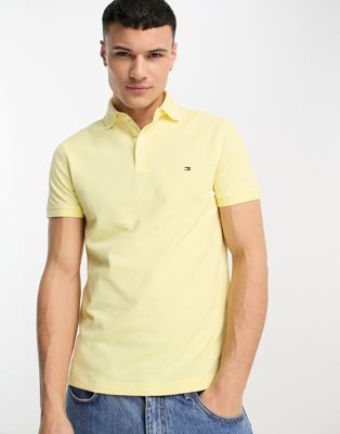 Tommy Hilfiger 1985 flag logo slim fit polo shirt in yellow | ASOS