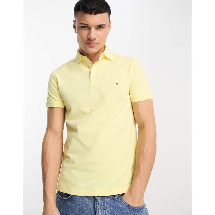 Tommy Hilfiger 1985 flag logo slim fit polo in yellow | ASOS