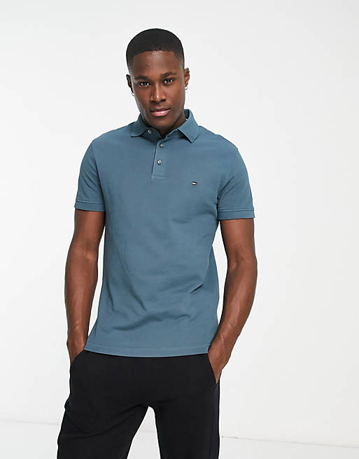 Tommy Hilfiger 1985 icon logo slim fit pique polo in blue | ASOS