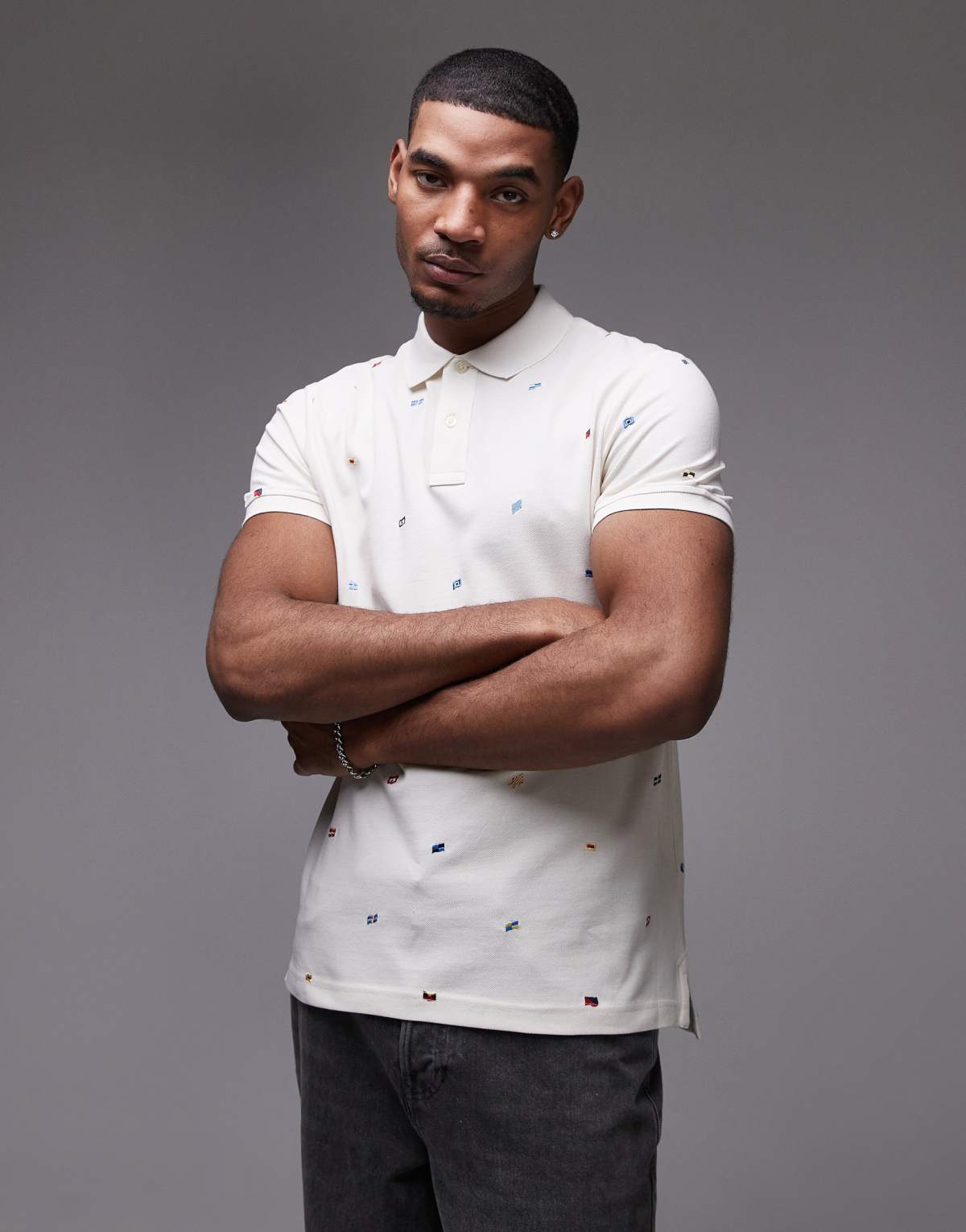 Tommy Hilfiger all over flag print polo shirt in off white