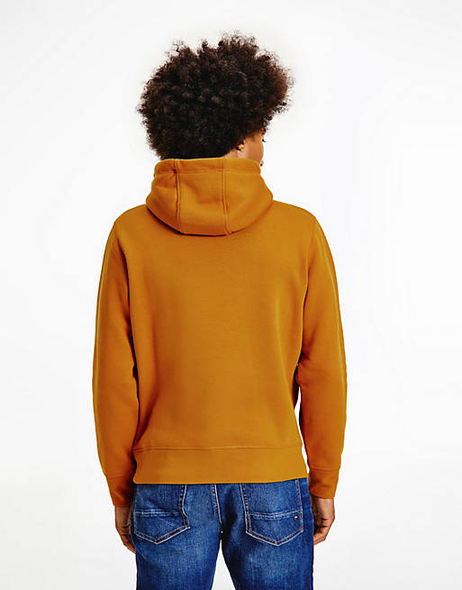 Tommy Hilfiger embroidered flag logo hoodie in gold | ASOS