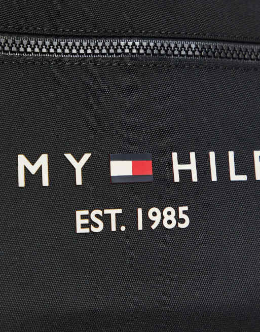 A logo sign outside of a Tommy Hilfiger retail store location in