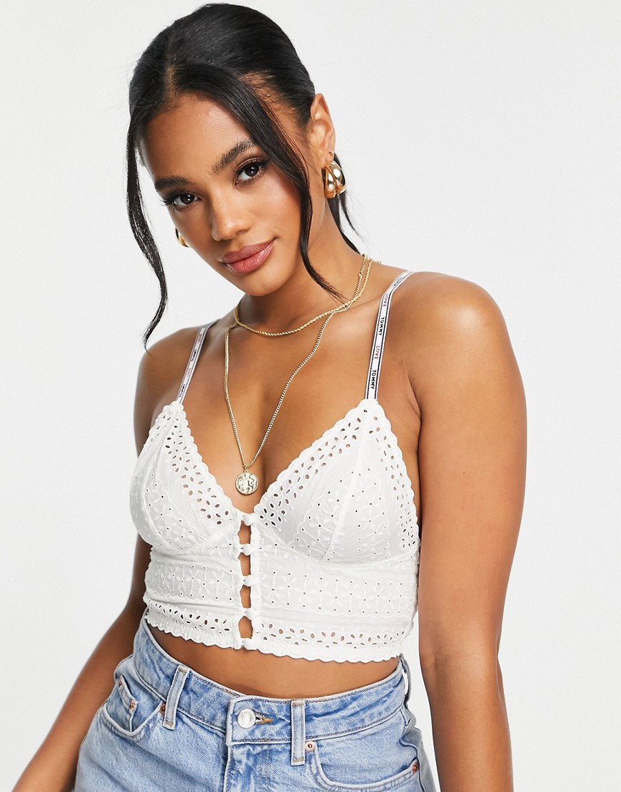 Tommy Hilfiger Eyelet longline broderie triangle bralet with button front detail in ivory-White