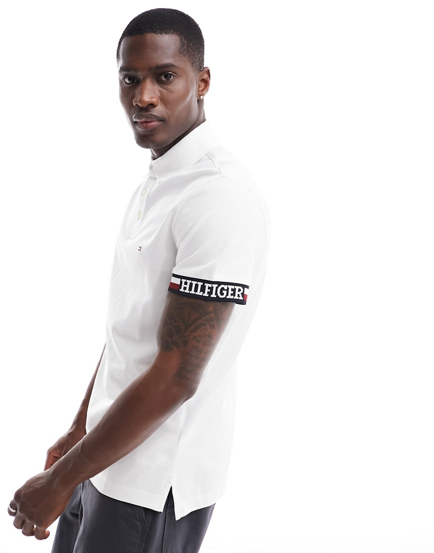 Shop Tommy Hilfiger Flag Logo Cuff Slim Polo Shirt In White