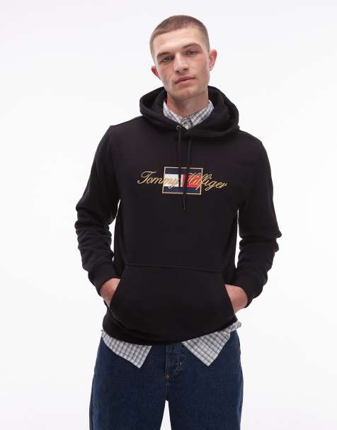 Tommy Hilfiger flag logo graphic hoodie in black with gold detail - view 1