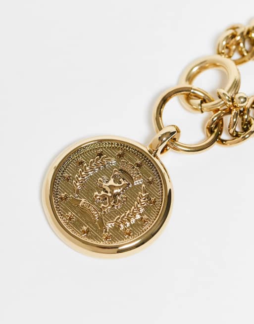 Tommy Hilfiger - Grove schakelarmband met munt in goud