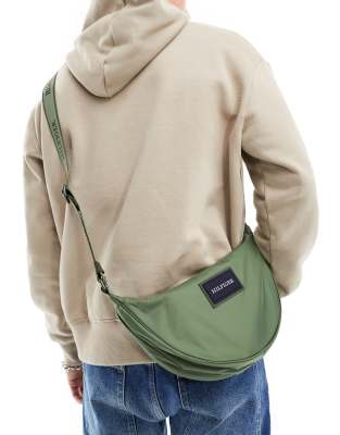 Tommy Hilfiger - Halvemaanvormige zomerse crossbody tas in groen