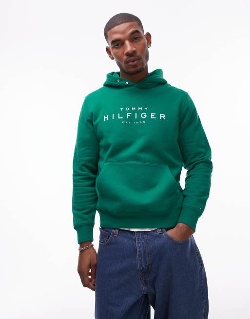 Tommy Hilfiger – Kapuzenpullover in Grün mit Logo und Druckknopfdetail