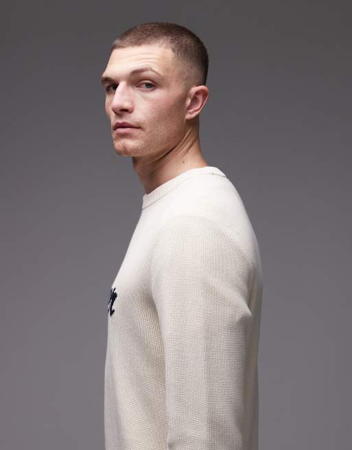 Tommy Hilfiger – Kremowy sweter z dużym logo tekstowym na środku, 2 z 5