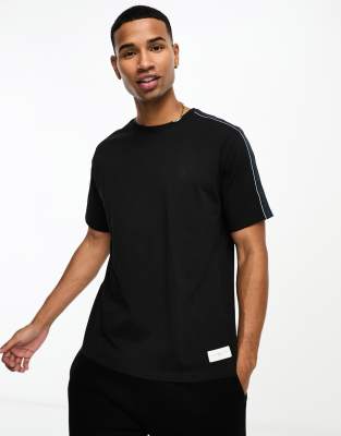 Tommy Hilfiger lounge logo t shirt with logo tapping in black | ASOS